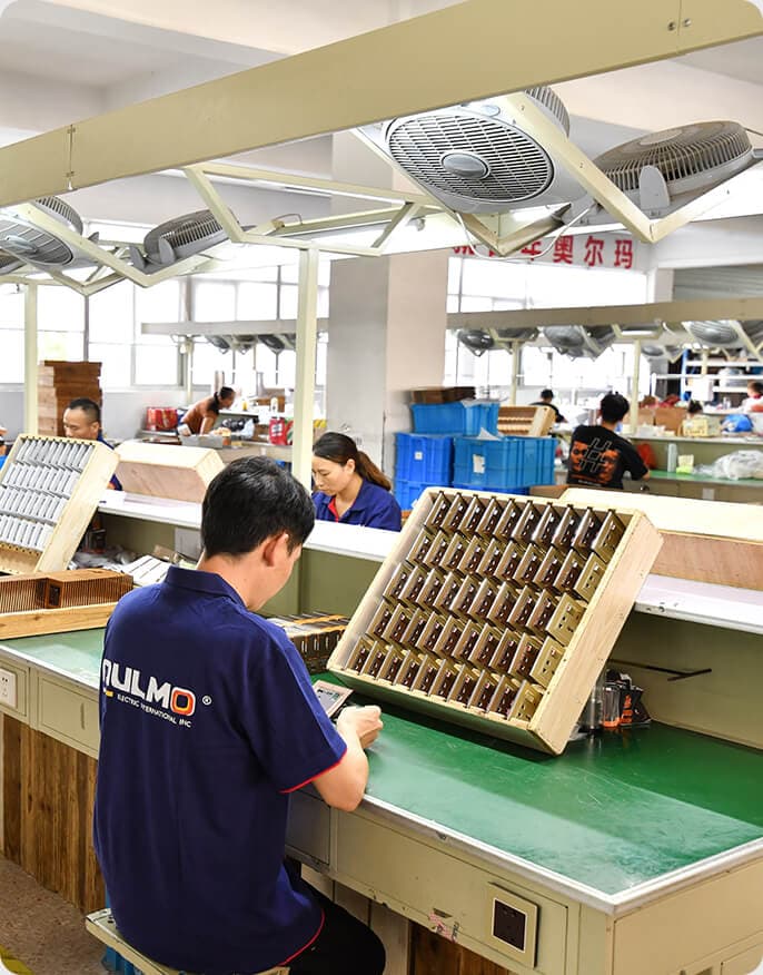 AULMO assembly line — switch components hand-assembled and inspected